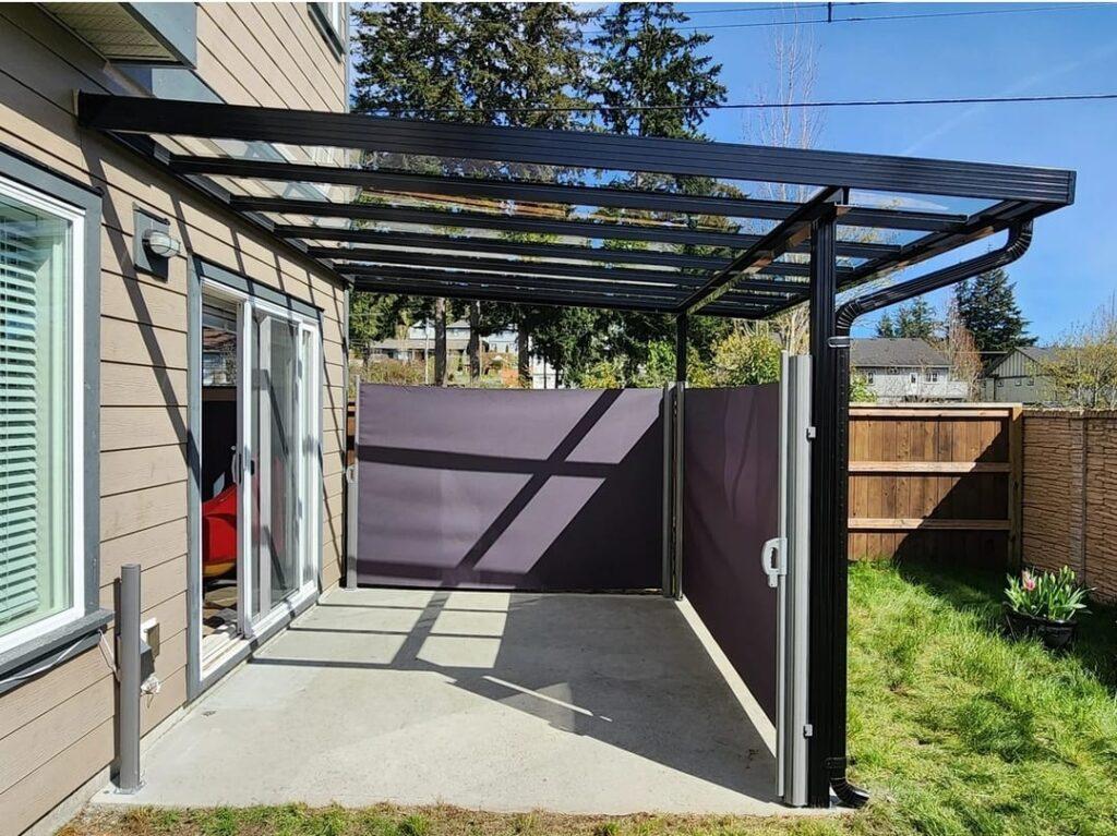 6’ x 10’ Retractable privacy wall with black polyester fabric Retractable privacy walls for aluminum patio covers in Richmond, ideal for outdoor space transformation with custom solutions.