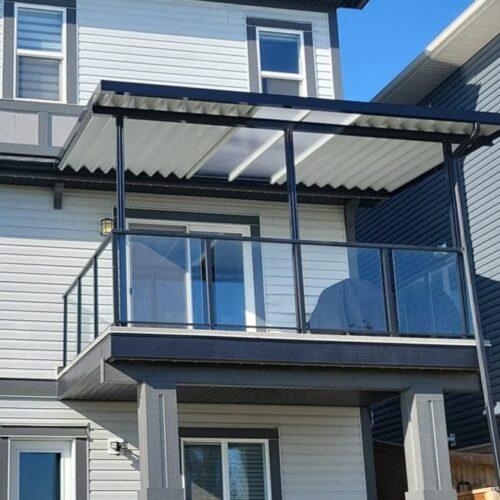 Aluminum patio cover with clear polycarbonate black frame