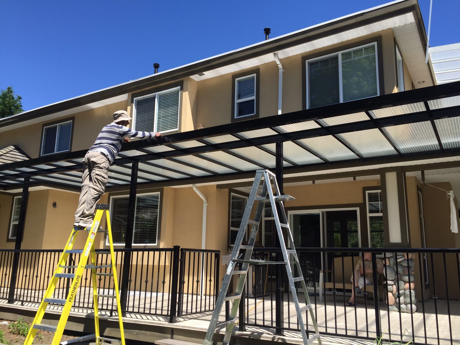 Aluminum patio cover aluminum patio cover installation by contractor in Canada with glass roof system